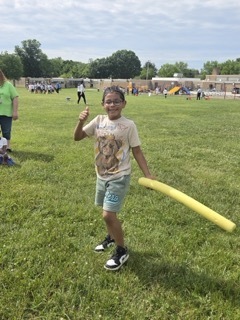 A student plays Turtle Tag at Field Day.