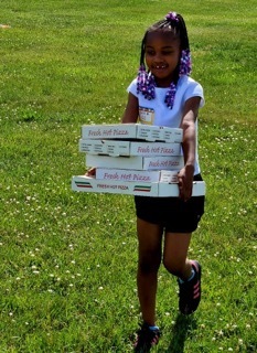 A student plays the Door Dash Relay at Field Day.