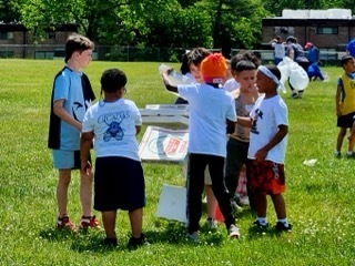 Students play the Door Dash Relay at Field Day