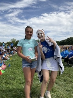 Ms. Turner poses with the student who gave her a pie in the face at field day.