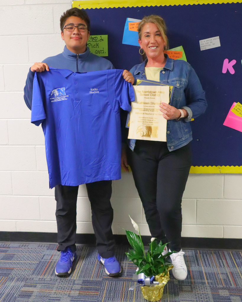 Ms. Shallow poses with a student after teacher of the year announcement.