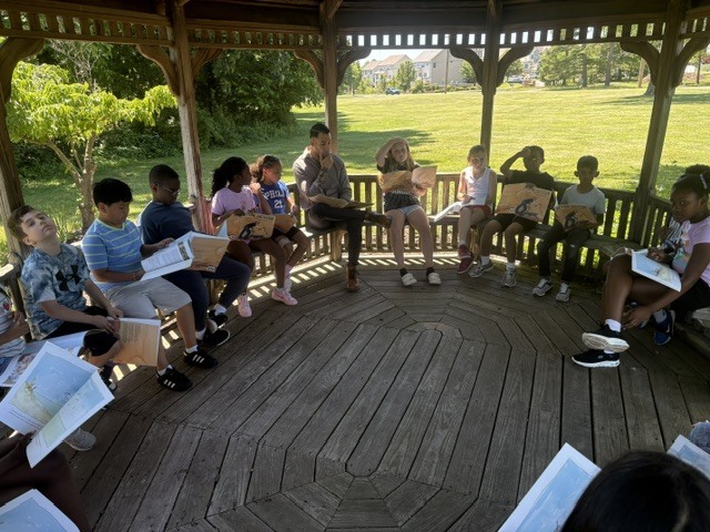 3rd Graders reading outside