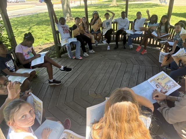 3rd Graders reading outside