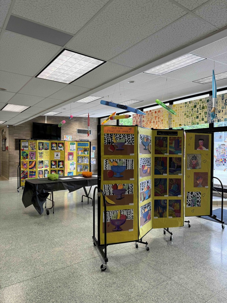 Student artwork displayed in the lobby for Marshall Street's annual Art Show.