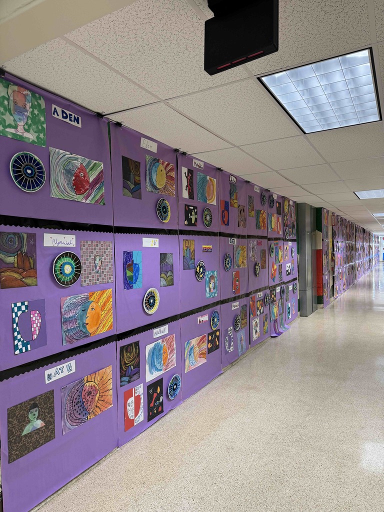 Student artwork displayed in the hallway for Marshall Street's annual Art Show.