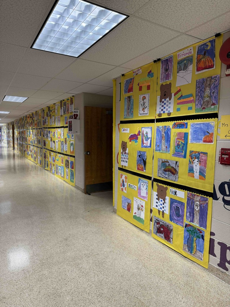 Student artwork displayed in the hallway for Marshall Street's annual Art Show.