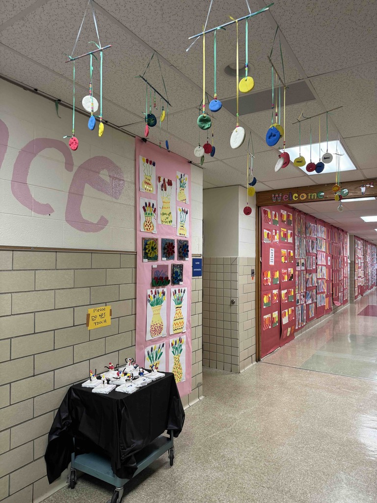 Student artwork displayed in the hallway for Marshall Street's annual Art Show.