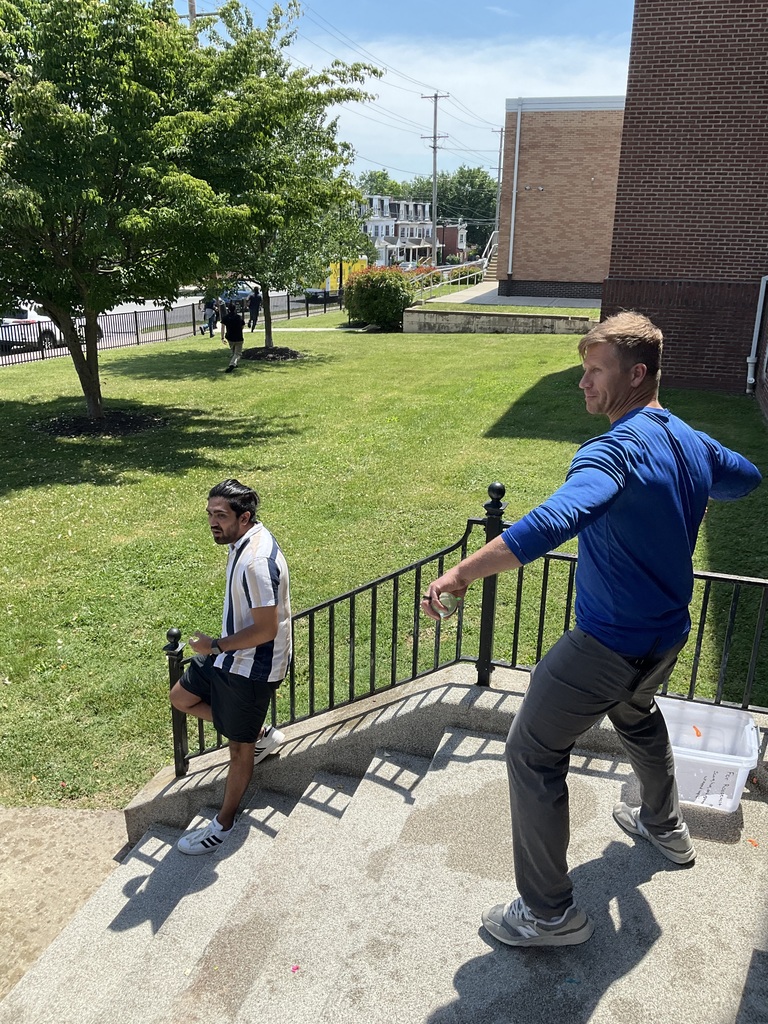 A staff member is throwing a water balloon