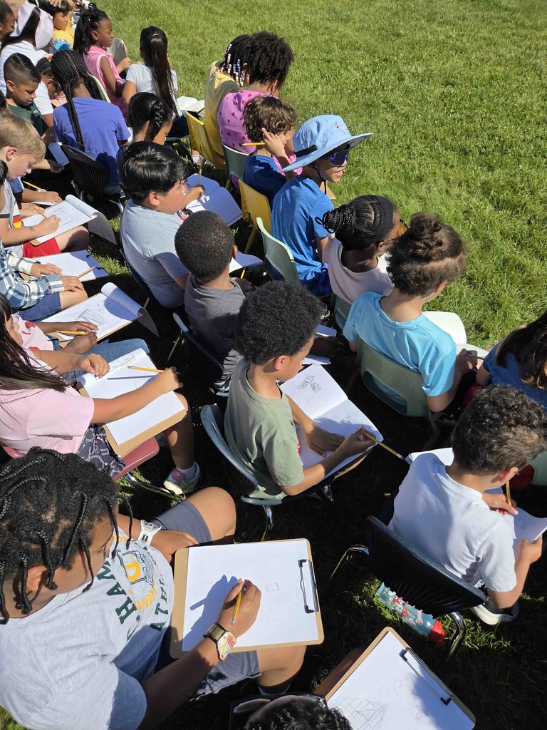 Students keep score during the game.