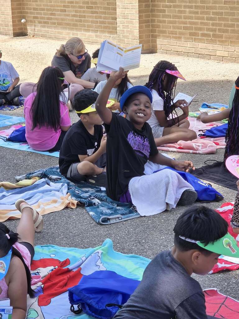 Students read their new books.