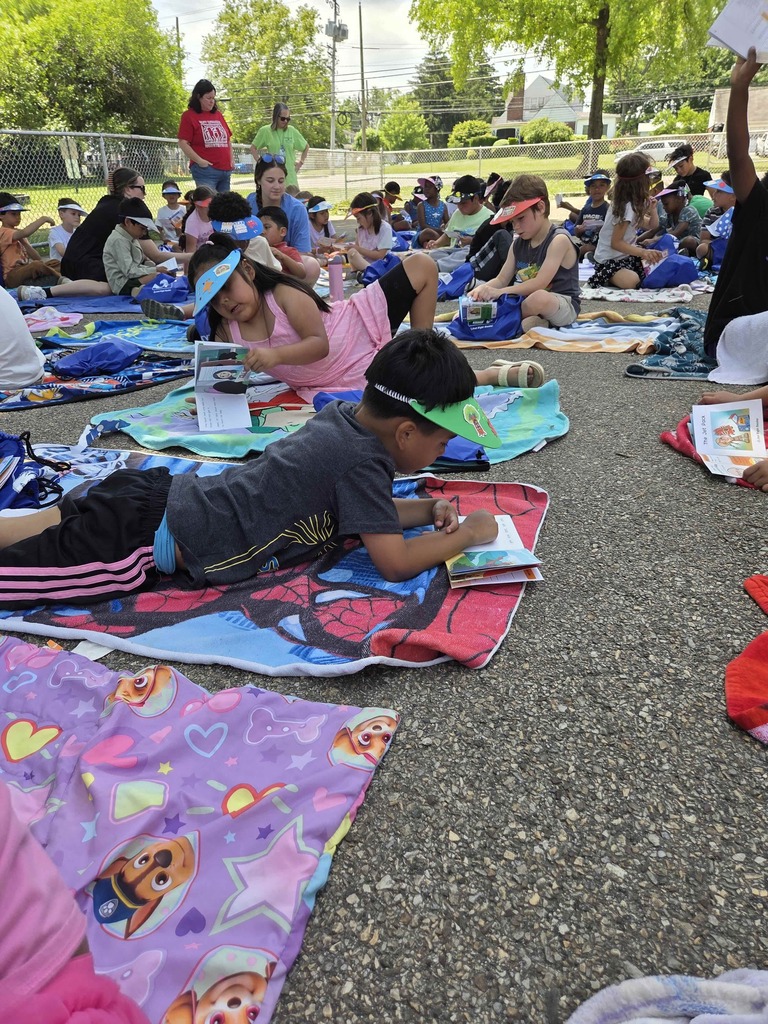 Students read their new books.