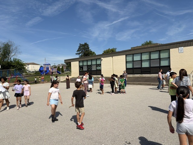 Students and families outside enjoying with their special someone and friends.
