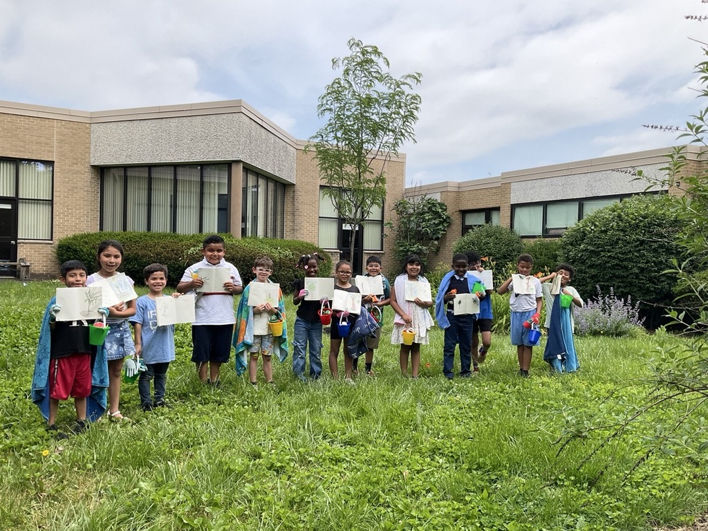 Mrs. Krause's class poses for a photo after using our nature journals.