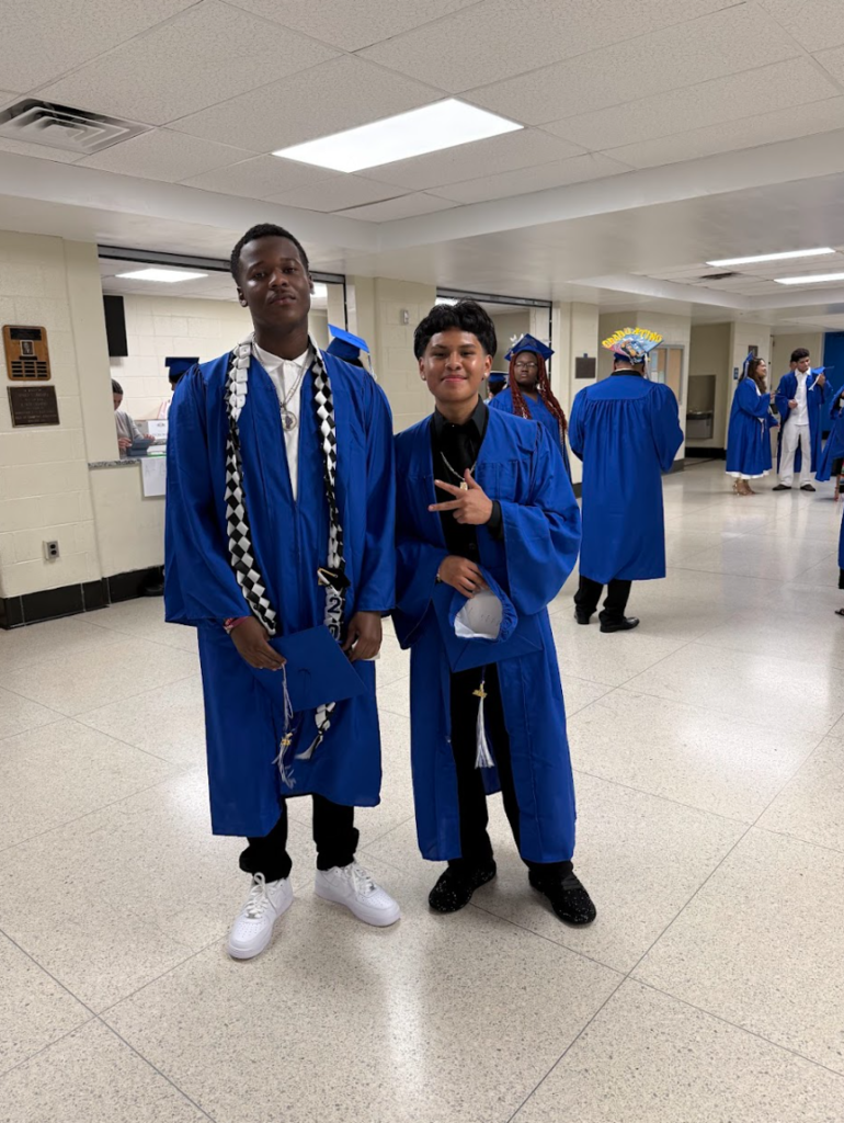 Two students are posing together 