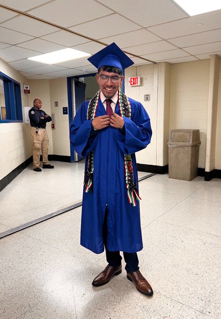 Students are walking out of the auditorium after commencement 