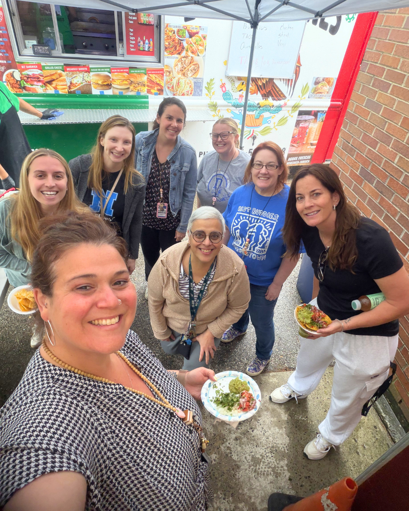 Staff take a group selfie.