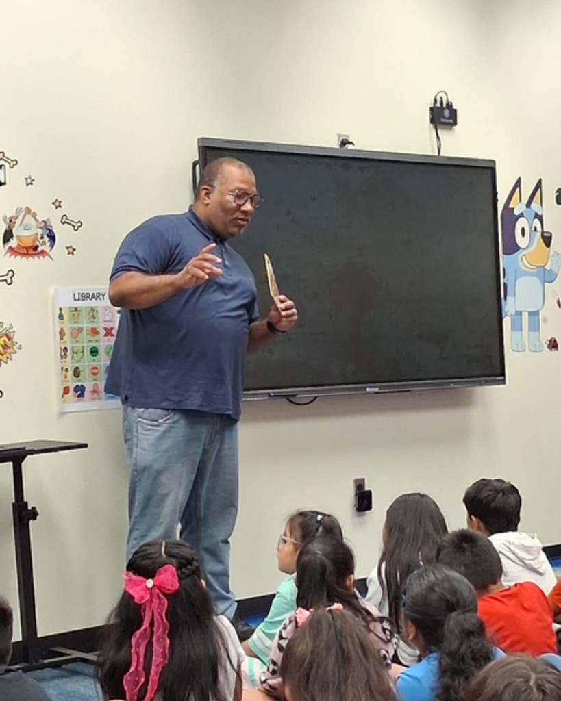 Mr. Hadrick speaking to students.