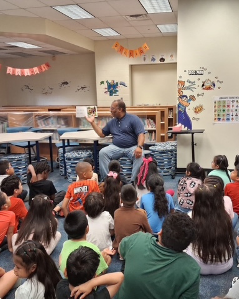 Mr. Hadrick reading to students.