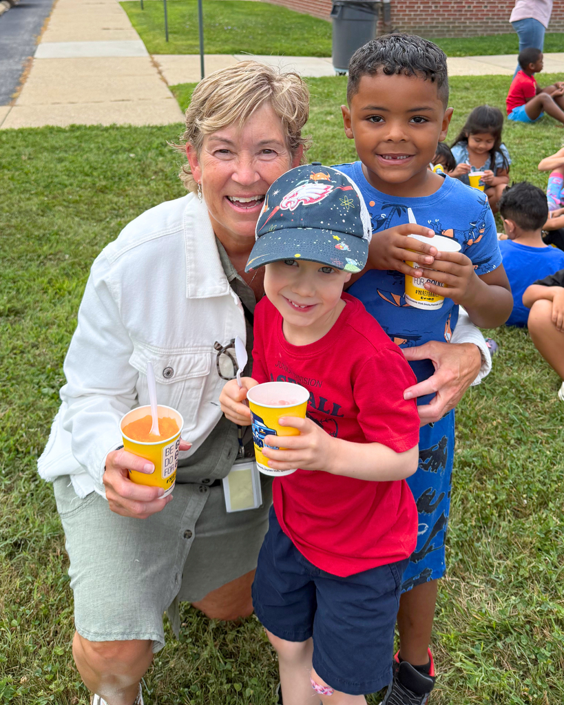 Dr. Cole with two students enjoying water ice on the last day of the summer program.