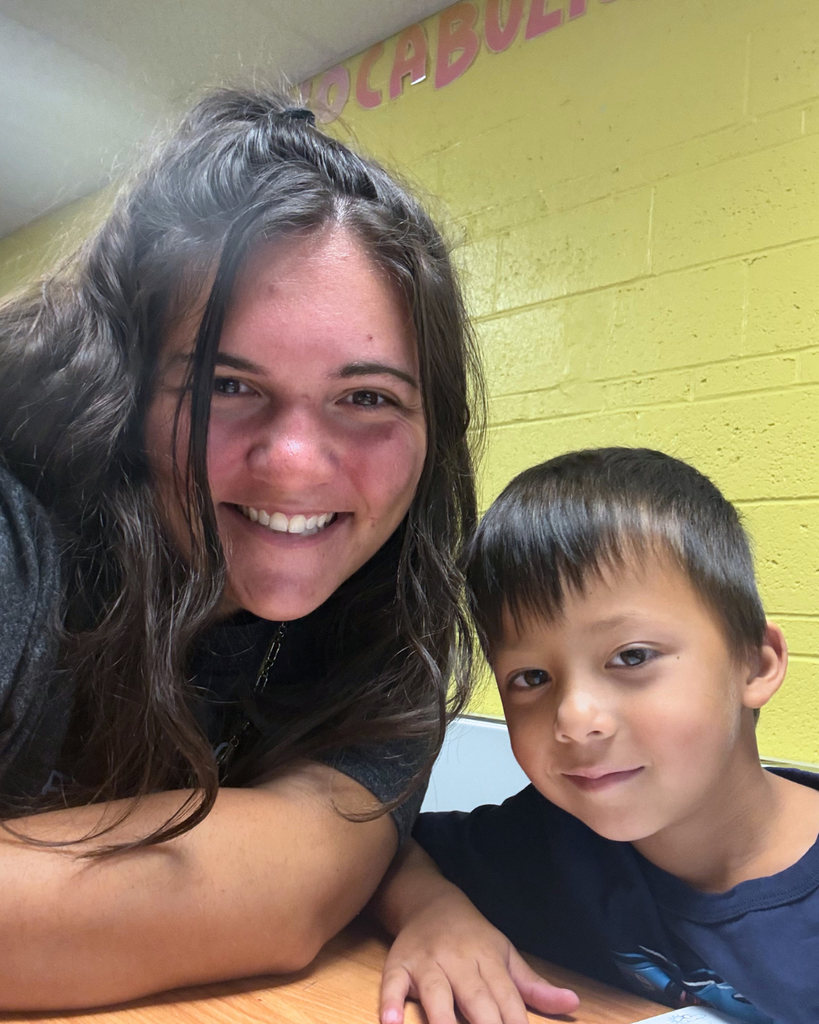 Teacher and student take a selfie.