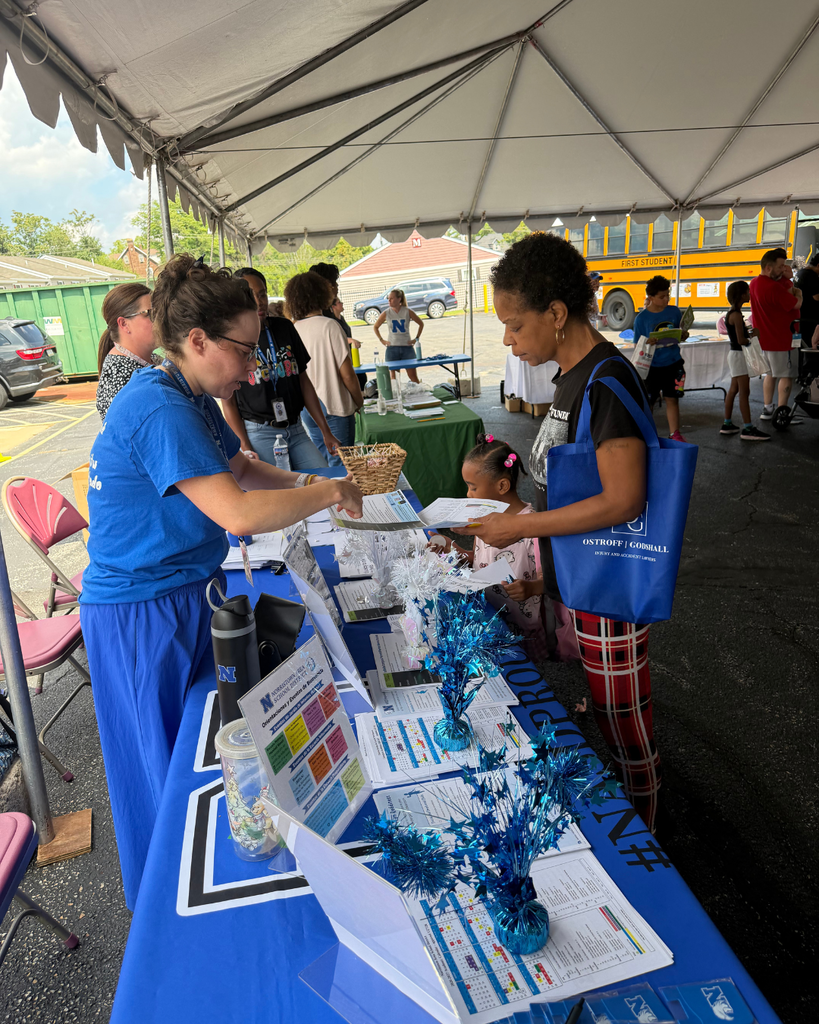 Families receiving helpful back to school information.