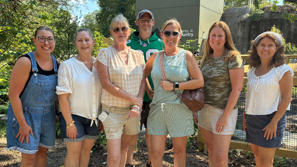 Group of teachers pose for photo.