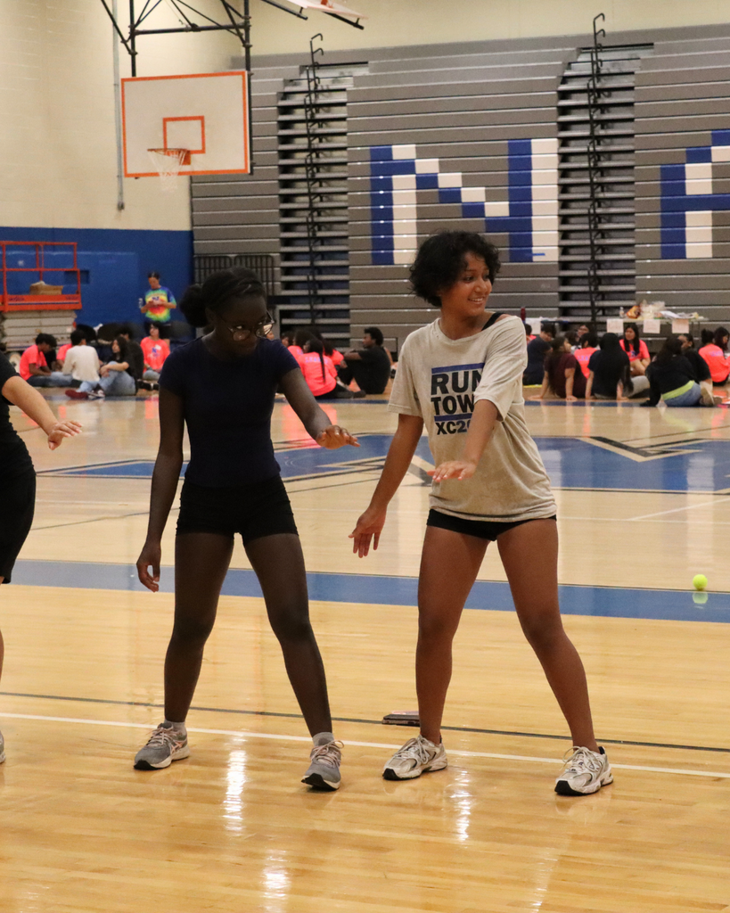 Young tennis players playing a game in the gym.