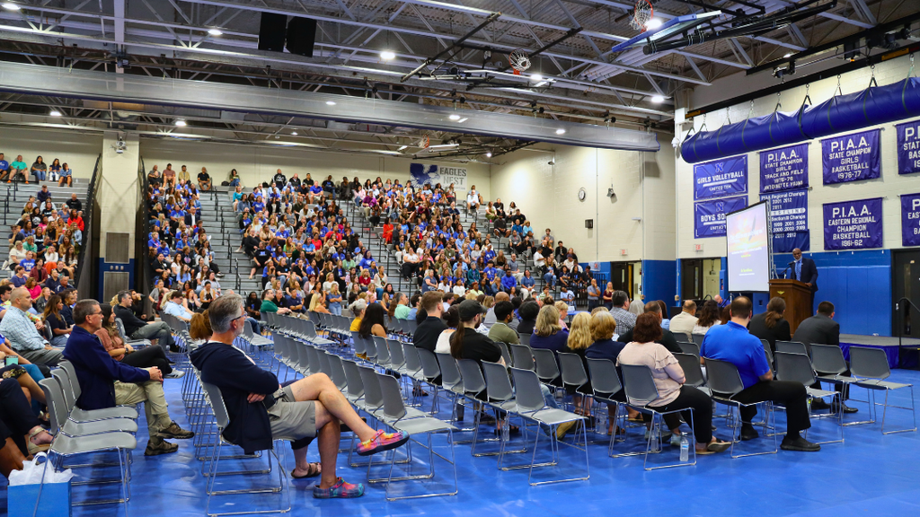 Wide view of the NAHS gym filled with teachers and staff.