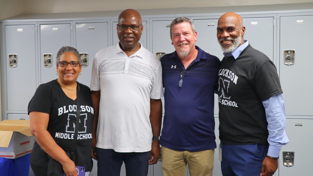 Dr. Green poses for photo with Blockson Middle School Staff.