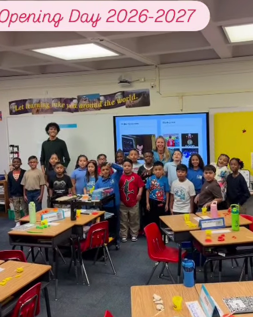 Students and staff pose for class photo.