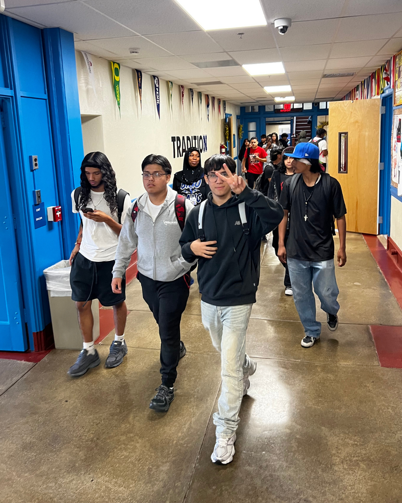 Students walking down the hallway.