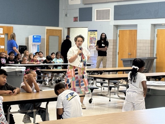 Mrs. Rooney reviews cafeteria expectations on the first day of school.