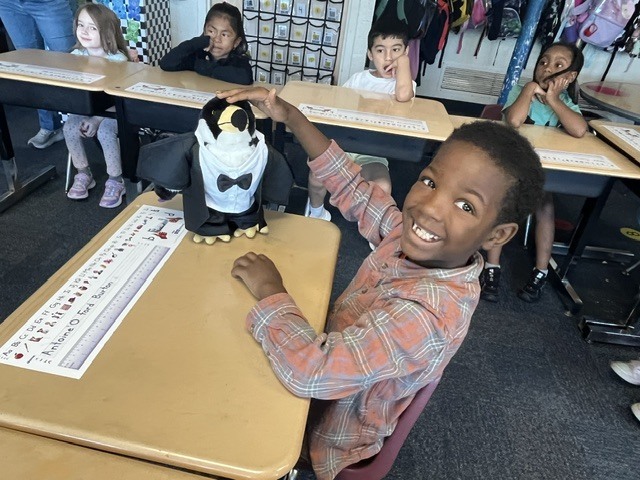 Students meet Oreo the reading falcon.