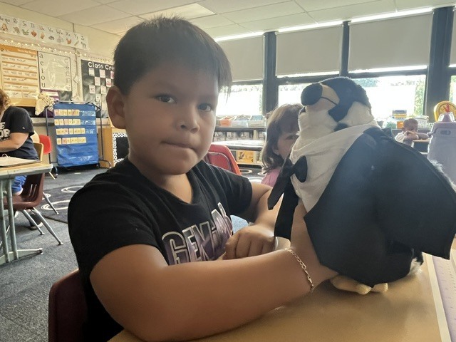Students meet Oreo the reading falcon.