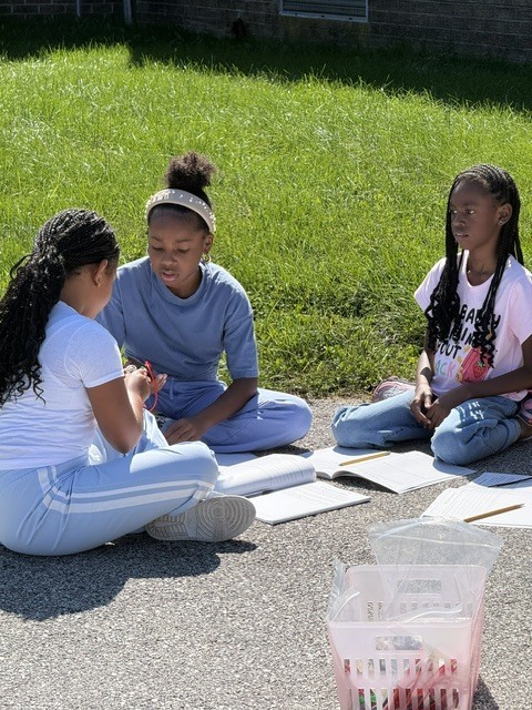 Fourth graders work to create a simple electrical system in science class.