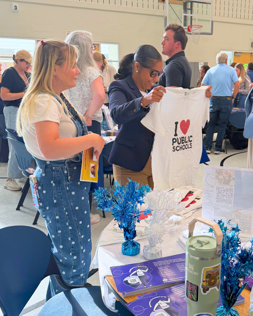 New teachers exploring the tables of community partners.