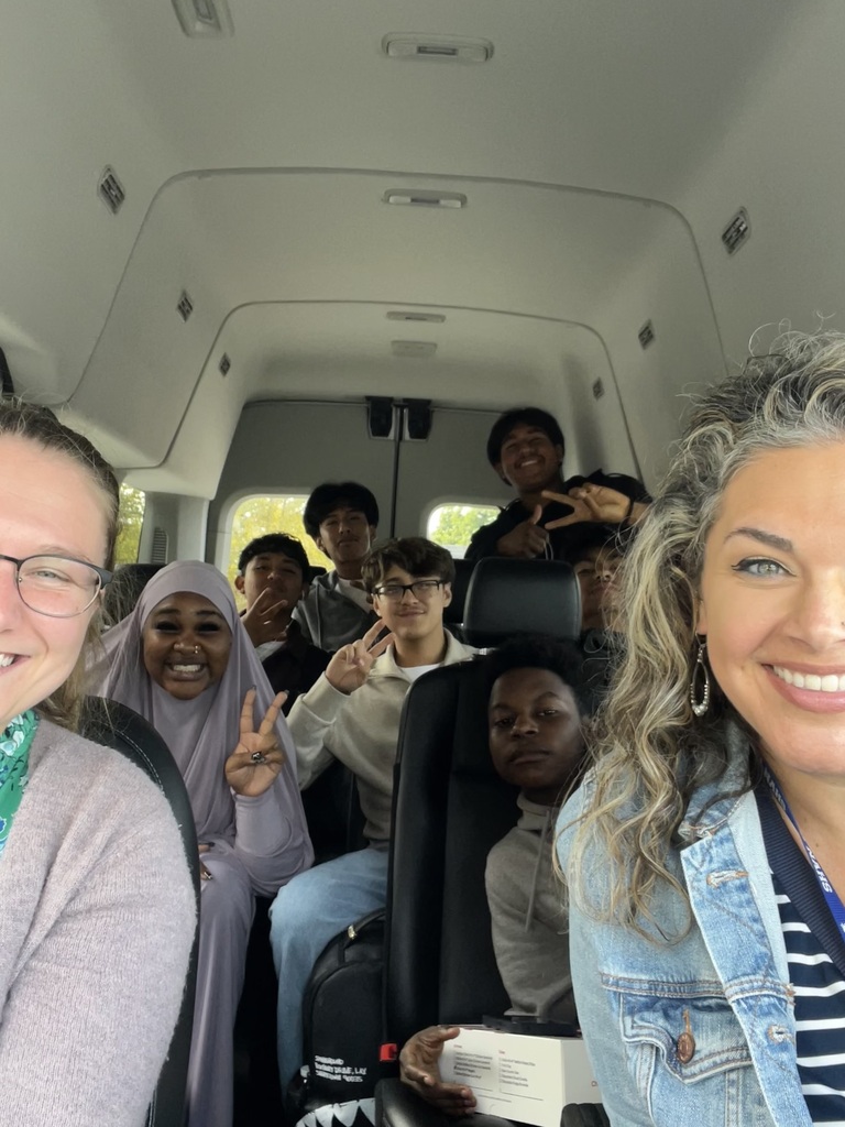 Teachers and students are talking a selfie in the car