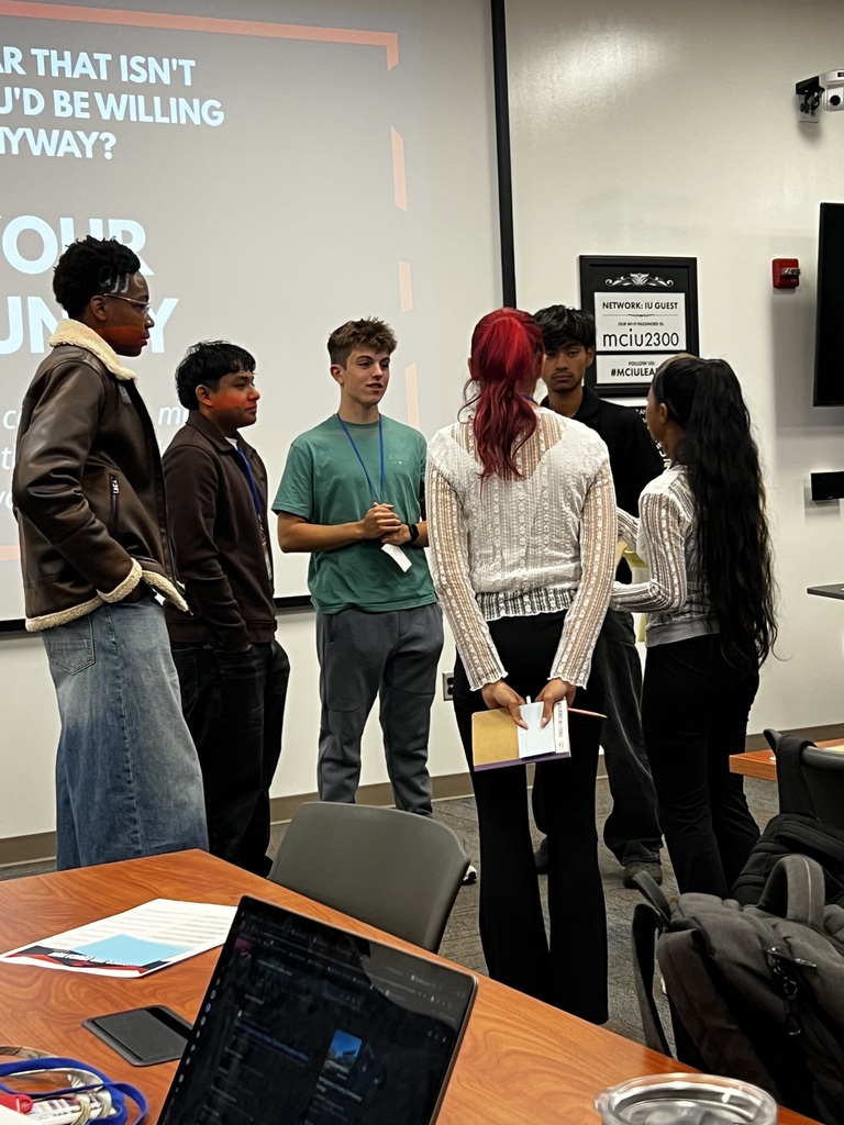 Students are standing around and talking together