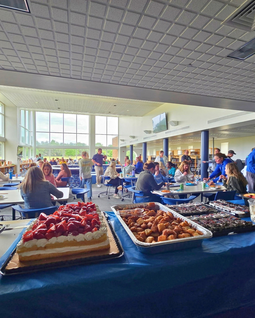 PFC serving food to teachers at East Norriton Middle School.