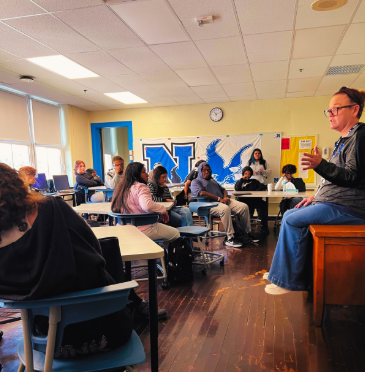 Students are sitting in a room listening to the counselor talk