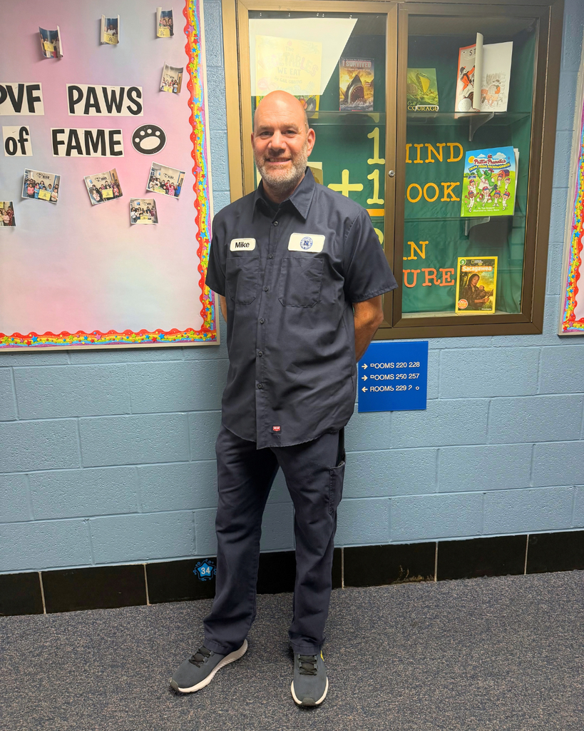Custodian smiles for photo.