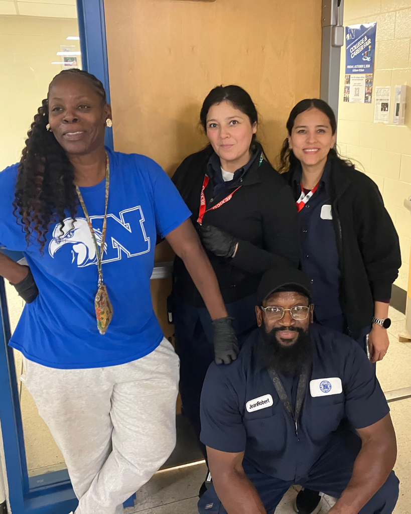 Custodial team poses for group photo.