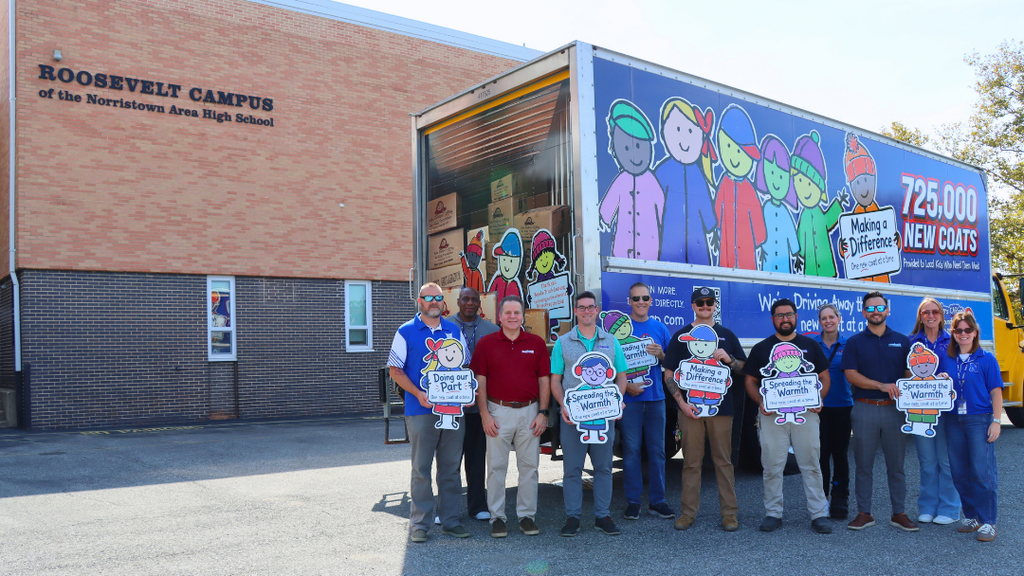 NASD and Conicelli team pose for photo in front of donation truck.