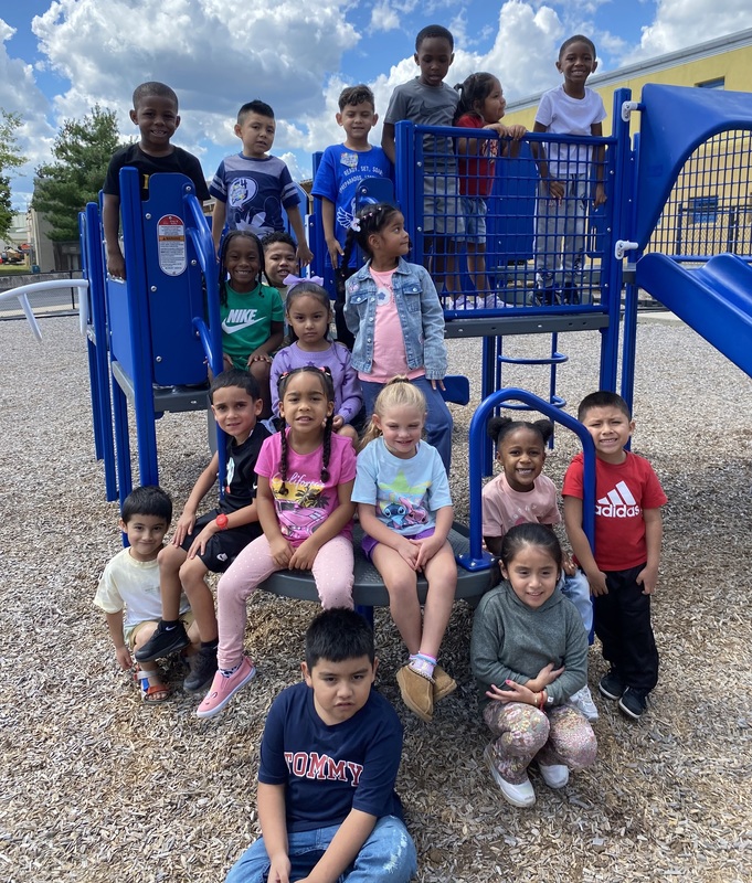 Kindergarten students learning in the classroom and enjoying recess on the playground.