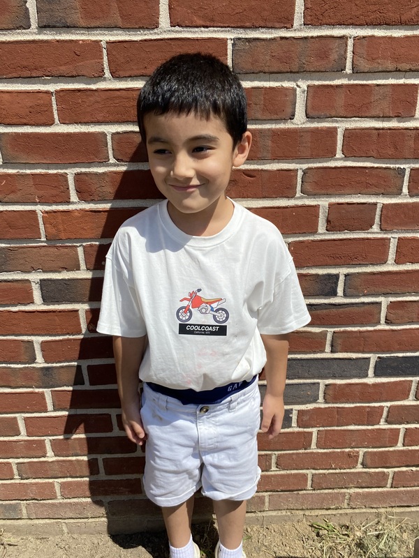 Kindergarten student outside enjoying recess on the playground