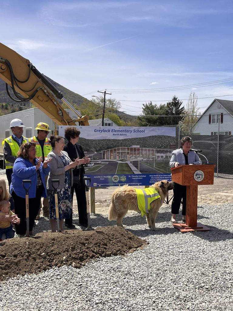 Mayor Macksey and unofficial "site foreman" Herbie the dog share remarks