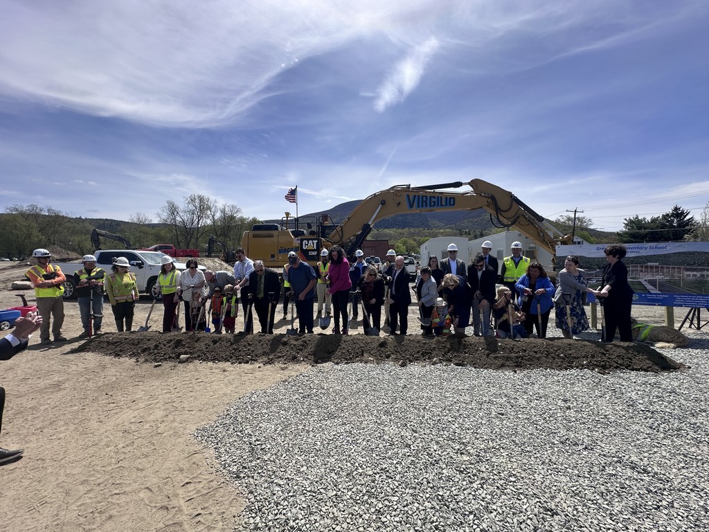 Groundbreaking committee in front of the site