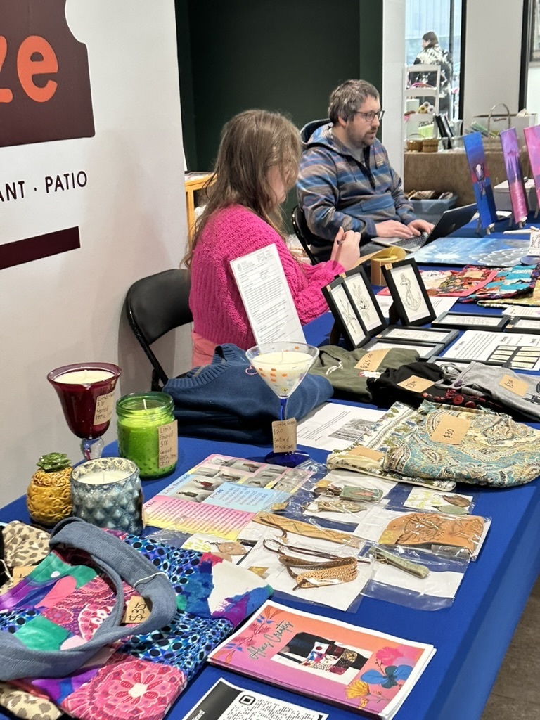 Student and Mr Brown at the art market sales table