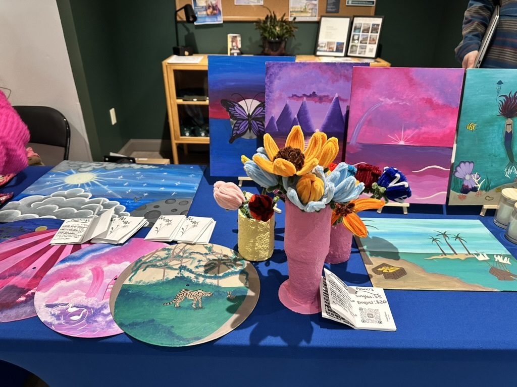 Paintings and forever flowers (knit) at art market