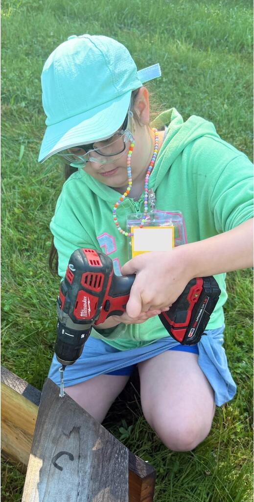 Student using a power drill